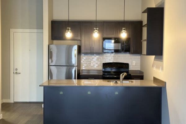 Ultra-modern kitchen in a model apartment at Outfield Ball Park Lofts in Lansing, Michigan