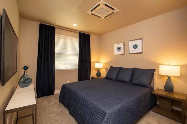 Master bedroom with window at Allure Apartments in Modesto, California