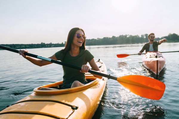 Map + Directions | A man and a woman happily kayaking near Waters Edge in Sacramento, California