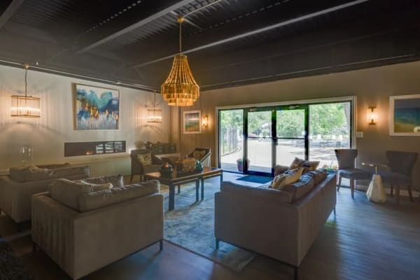 Indoor community seating with ambient lighting at Tanglewood Apartments in Hammond, Indiana