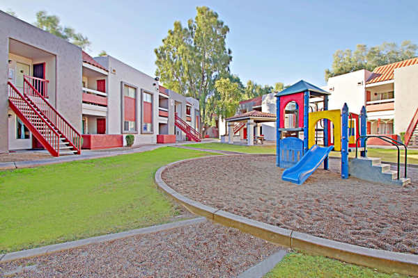 Playground and lawn at 544 Southern Apartments in Mesa,Arizona