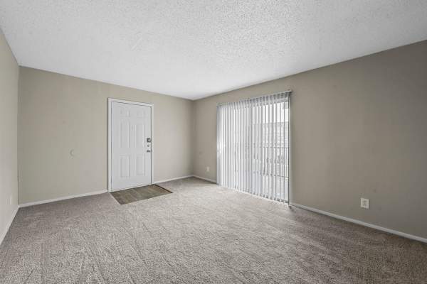 Bedroom with access to private balcony atFinley Square in Irving. TX