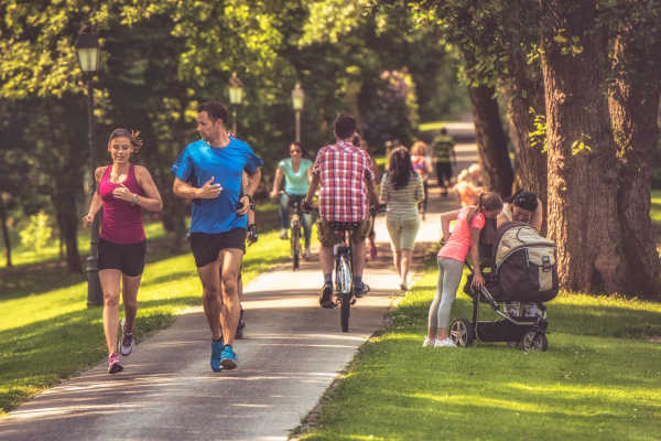 Resident walking their dogs on the Katy Trail Remi in Dallas, Texas