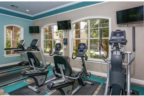 Fitness center with treadmill at The Legends At ChampionsGate in ChampionsGate, Florida
