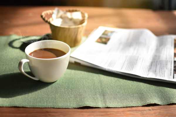 A paper and a cup of coffee at Raystone Apartments in Phoenix, Arizona