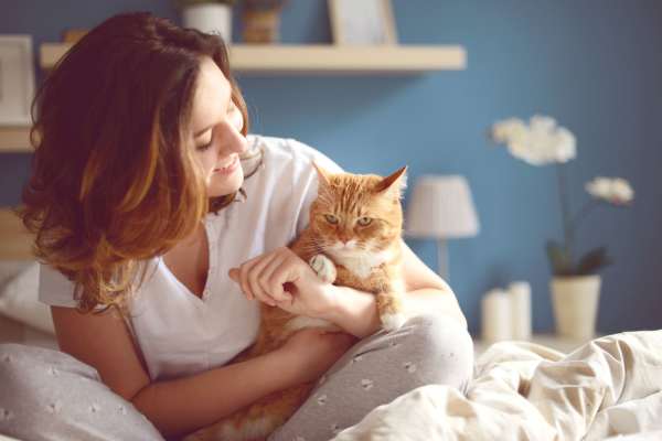 Woman embracing her pet cat at 544 Southern Apartments in Mesa,Arizona
