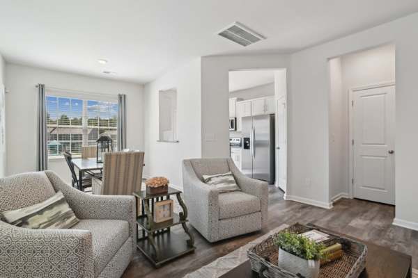 Living room with chairs at Norman Ridge Townhomes in Terrell, North Carolina