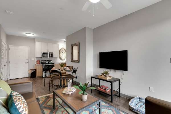 Living room with a television at The Edge in Pensacola, Florida
