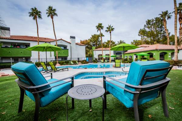 Luxury pool with cornhole area at Parkway Townhomes in Henderson, Nevada