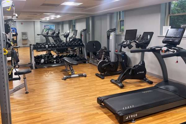Well-equipped fitness center at Camelot Court in Brighton, Massachusetts