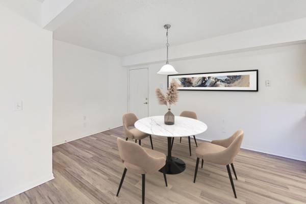 Retro-modern furniture and classic decor in a model home's living area at Springbrook Meadows Apartments in Jackson, Michigan