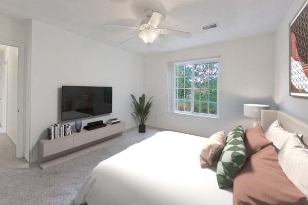 Retro-modern furniture and classic decor in a model home's living area at Legacy Parke Apartments in Charlotte, Michigan