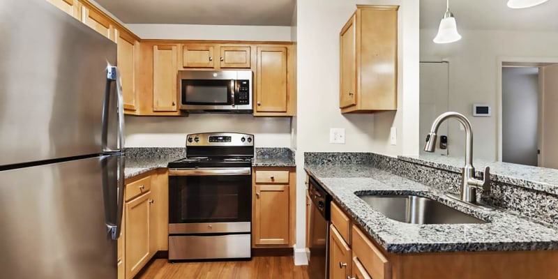 Model kitchen with granite countertops at Fox Run Apartments in Edgewood, Maryland