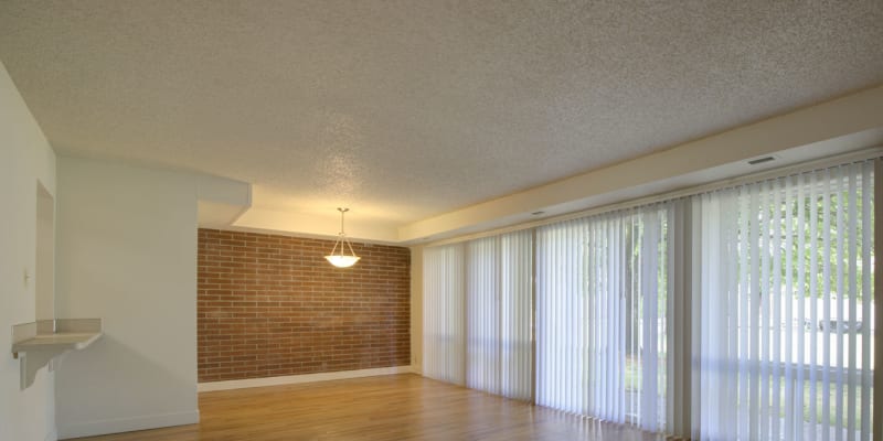 Open concept livingroom with floor to ceiling windows at Greenwood in Joint Base Lewis McChord, Washington