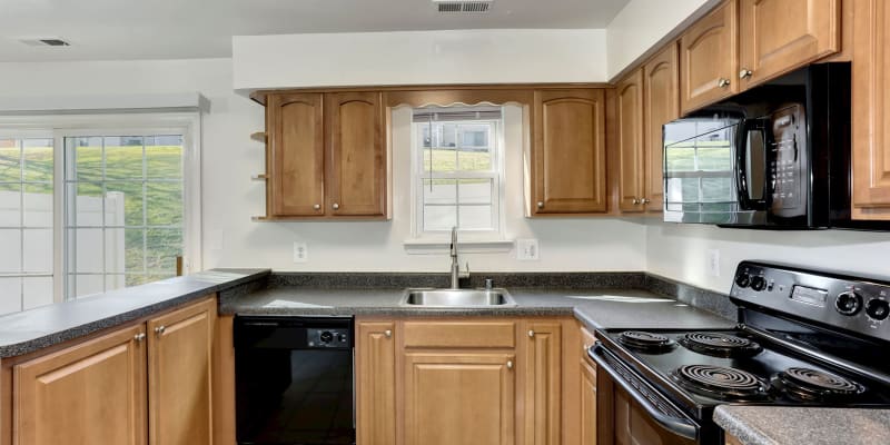 Model kitchen with granite countertops at Olde Forge Townhomes in Nottingham, Maryland