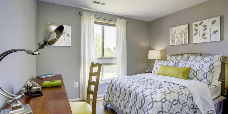 Cozy bedroom at Tuscany Gardens Apartments in Windsor Mill, Maryland