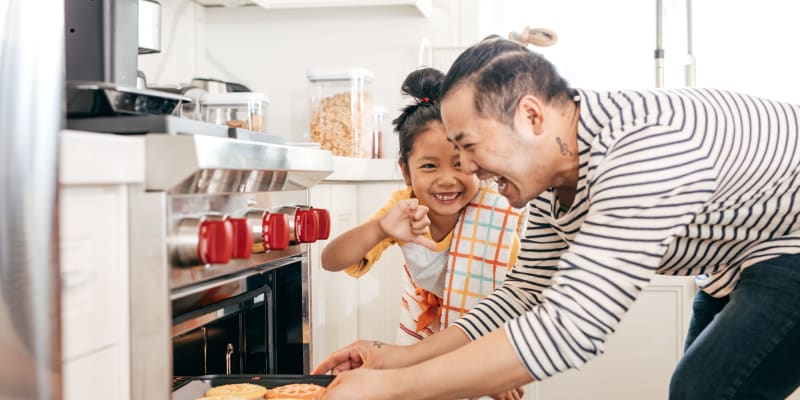 A father and daughter baking cookies at Prospect View in Santee, California