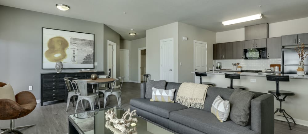 Open concept apartments, living room and kitchen view at Terrene at the Grove in Wilsonville, Oregon