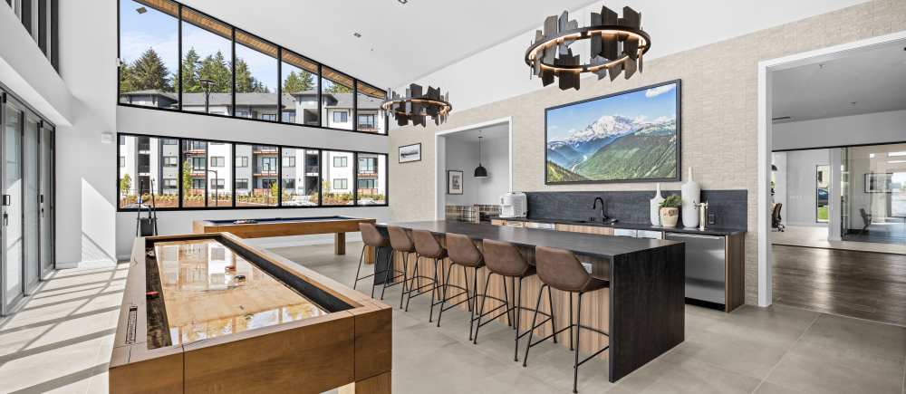 The clubhouse with pool table, shuffle board and entertainment space The Highlands at Silverdale in Silverdale, Washington