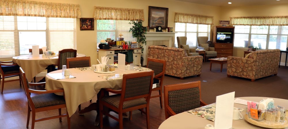 Cheerful dining area with wood accents in upscale senior living facility at The Springs at Willowcreek in Salem, Oregon
