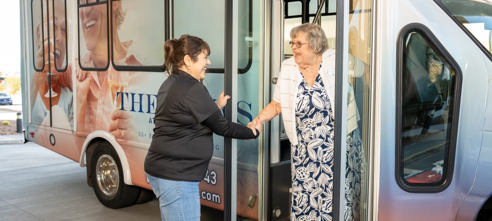 Staff helping residents off the bus at The Views at Lake Havasu in Lake Havasu City, Arizona