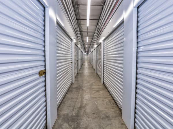 Hallway of units at StorQuest Self Storage in Aurora
