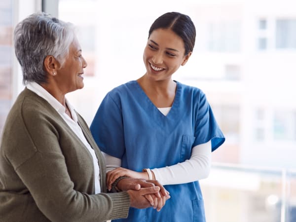 A staff member and resident talking at The Lakes at Banning in Banning, California. 