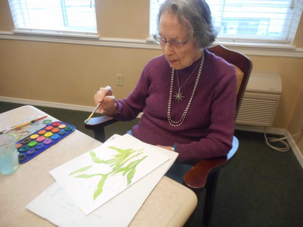 A resident making art at Patriots Glen in Bellevue, Washington. 