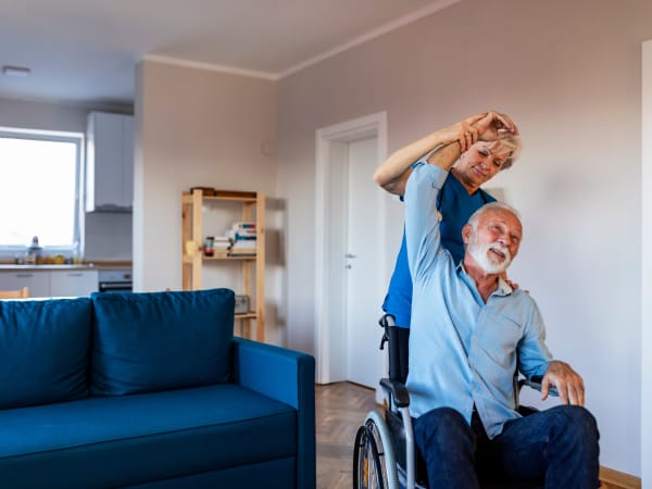 A health professional helping a patient stretch at Careage Home Health in Dupont, Washington. 