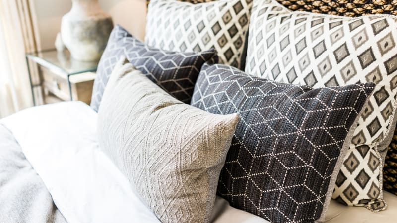 Cozy bedroom at Crestone Apartments in Brighton, Colorado