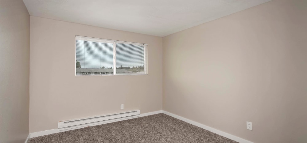 Bedroom with great natural lighting at Heights at Sheridan in Bremerton, Washington
