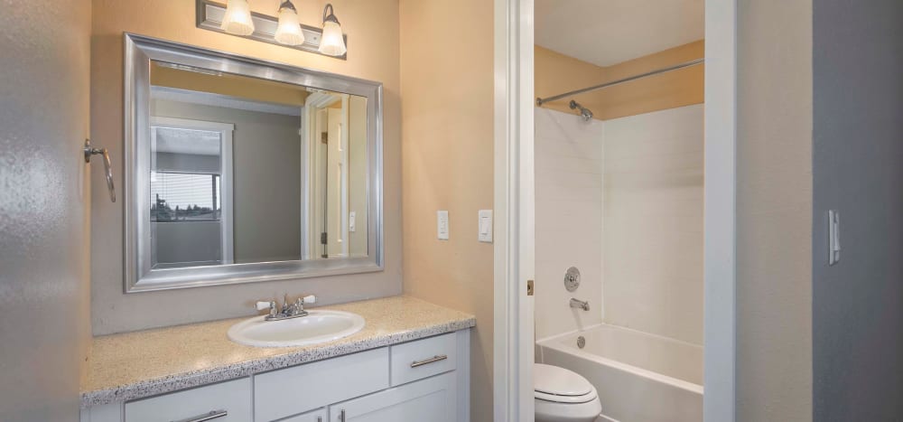 Bathroom with good lighting at Heights at Sheridan in Bremerton, Washington
