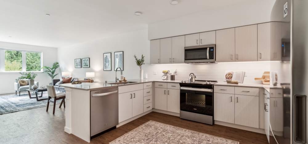 Spacious kitchen and living room apartments at Traxx Apartments in Mountlake Terrace, Washington 