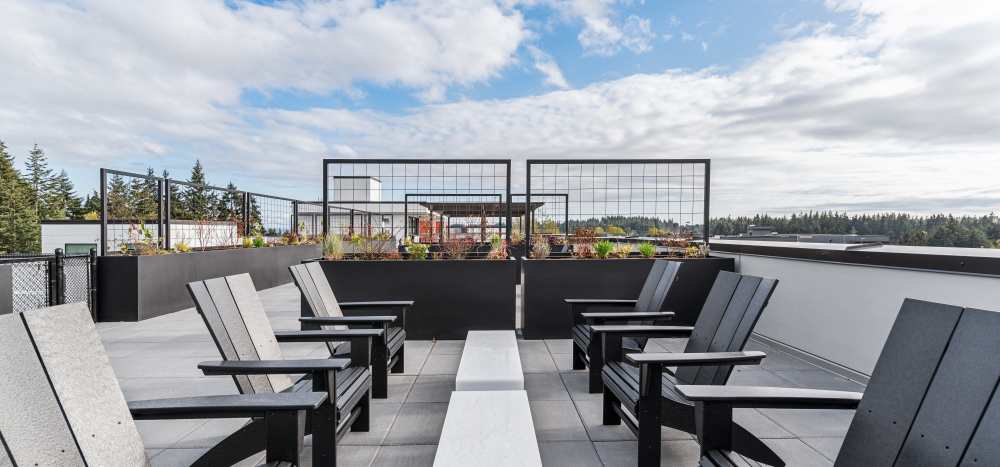 Roof Deck with outdoor seating, firepits and grill area at Traxx Apartments in Mountlake Terrace, Washington 