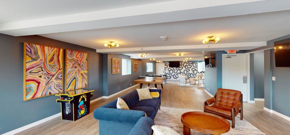 Community Lounge with kitchen and games at Thea Apartments in Tacoma, Washington