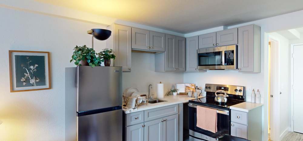Efficient kitchens with microwaves at Thea Apartments in Tacoma, Washington