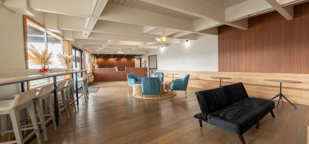 Resident clubhouse lounge and leasing office at  Thea Apartments in Tacoma, Washington