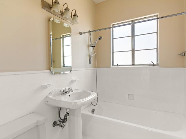 All white bathroom with Windows and natural light at The Monterey Garden San Mateo, California