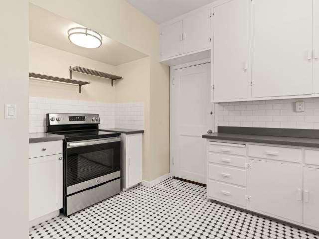 Stainless steel stove and a beautiful white kitchen at The Monterey Garden San Mateo, California