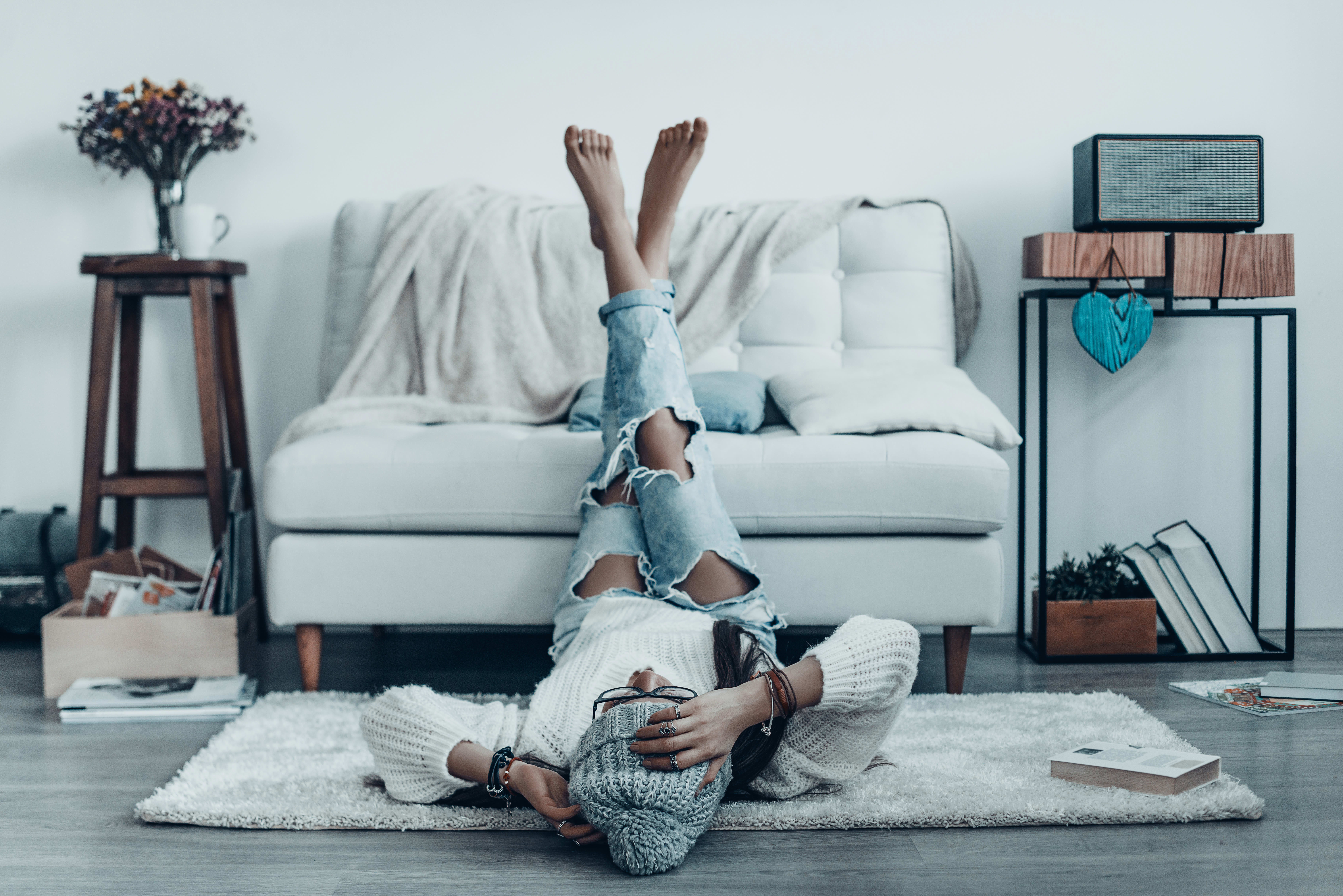 Woman spending time on her living room at Diamond at Prospect Apartments in Denver