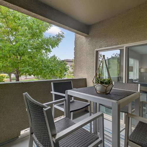 Kitchen with stainless-steel appliances and counter seating at The Trails at Pioneer Meadows in Sparks, Nevada
