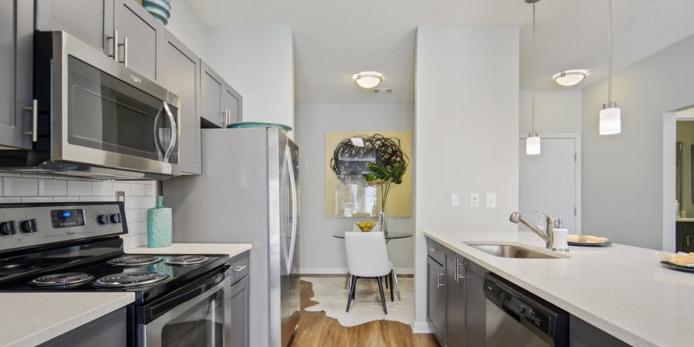 Fully equipped kitchen with stainless steel appliances at Ellington Midtownin Atlanta, Georgia