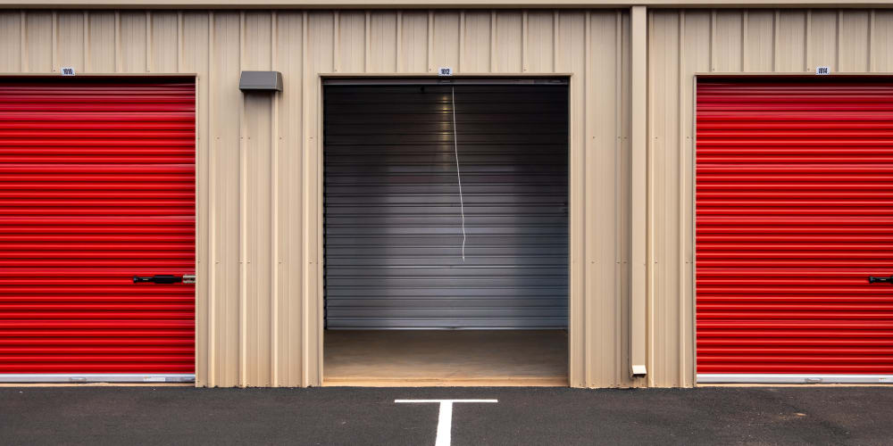 Outdoor units, one with an open door at StorQuest Express Self Service Storage in Tracy, California