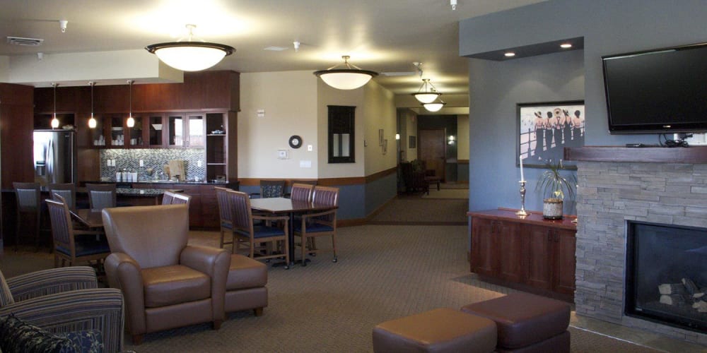 Classic lounge complete with comfy leather chairs, televisions and fireplace at The Springs at Mill Creek in The Dalles, Oregon