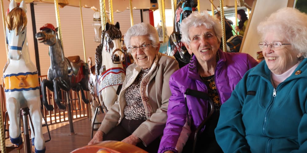 Residents socializing at a carousel at The Springs at Butte in Butte, Montana