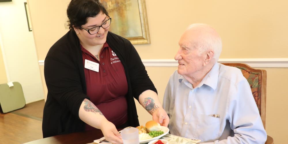 Resident being served by caregiver at The Springs at Willowcreek in Salem, Oregon