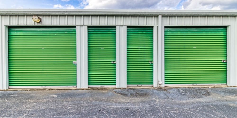 Green storage unit doors on our outdoor storage units at Devon Self Storage in Williamsburg, Virginia