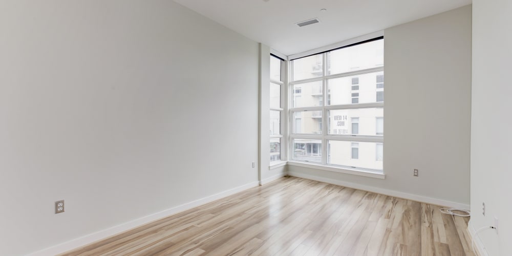Empty well lit bedroom with some very nice light wood style flooring at 1350 Florida in Washington, District of Columbia