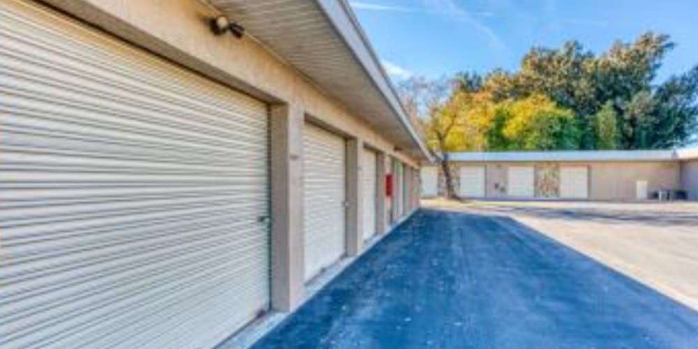 Wide driveways provide easy access to outdoor storage units at Devon Self Storage in Gulfport, Florida