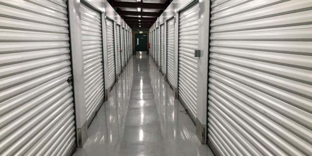 Bright and clean indoor storage hallway at Devon Self Storage in North Bend, Washington